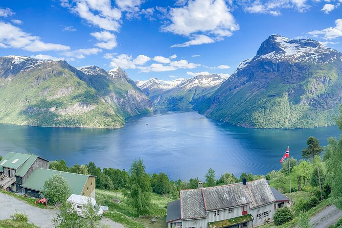 All About the Fjords in One Tour by Bus and Boat from Ålesund - Hjørundfjord by boat, from open water to mountain walls