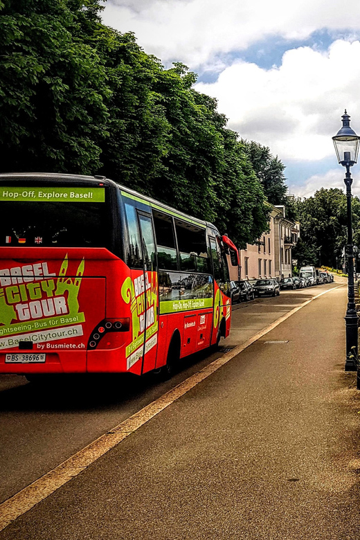 Basel: Sightseeing Bus Tour with Audio Guide - City walls, paper, and fine art