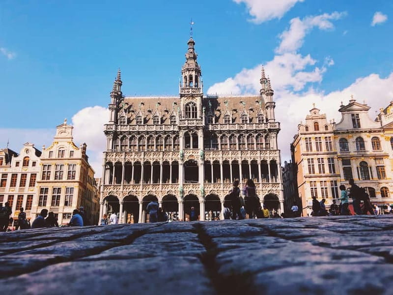 Brussels Highlights: Walking & Bus Tour with Waffle Tasting - A waffle break inside the Royal Galleries