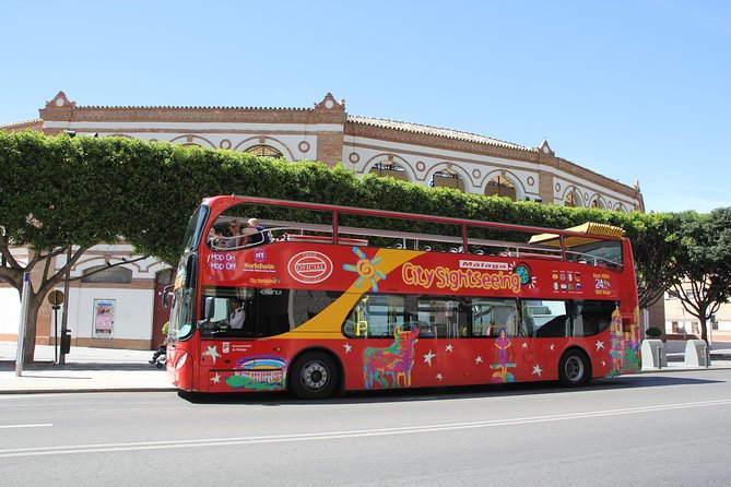 City Sightseeing Malaga Hop-On Hop-Off Bus Tour - Audio, seating, and service details