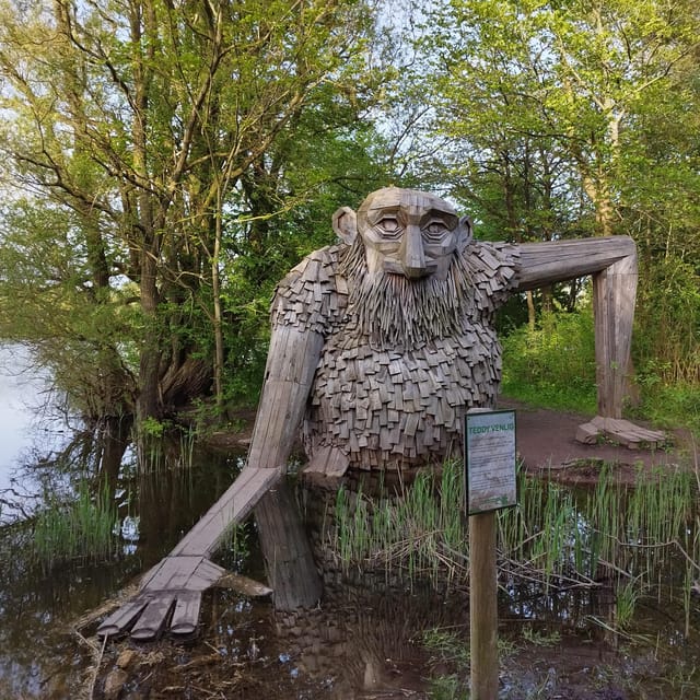 Copenhagen: Six Forgotten Giant Sculptures Tour by Bus - Sleeping Louis: the first giant sets the tone