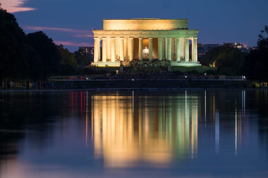 DC: Open-top Monuments and Memorials Sightseeing Night Tour - The tidal basin memorials after sunset