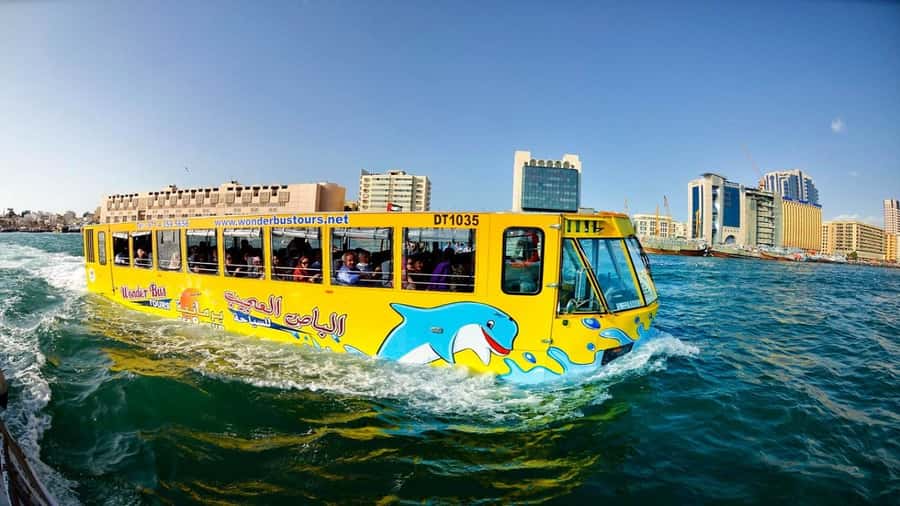 Dubai: Old town tour with Wonder Bus, souks, Creek and Guide - Textile Market and Heritage Village