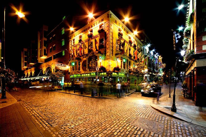 Dublin Live Guided Panoramic Open-Top Night Bus Tour - Temple Bar after sunset
