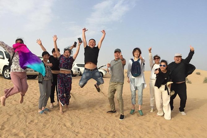 Evening Desert Safari Dubai with BBQ Dinner (Pick Up By Bus) - Sandboarding, camel riding, and optional extras