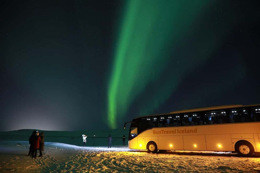 From Reykjavik: Northern Lights Bus Tour with Hot Cocoa - How the four-hour aurora hunt works