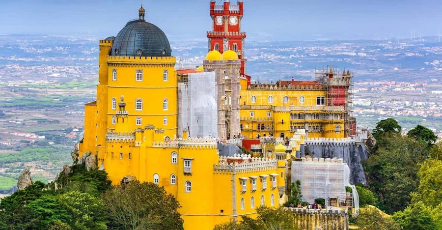 From/To Lisbon: Sintra Hop-on Hop-off Tickets + Audio Guide - Pena Palace brings color, towers, and royal spectacle