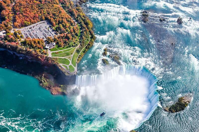 From Toronto: Niagara Falls Bus Tour with Boat Cruise - Journey Behind the Falls and the 125-foot descent