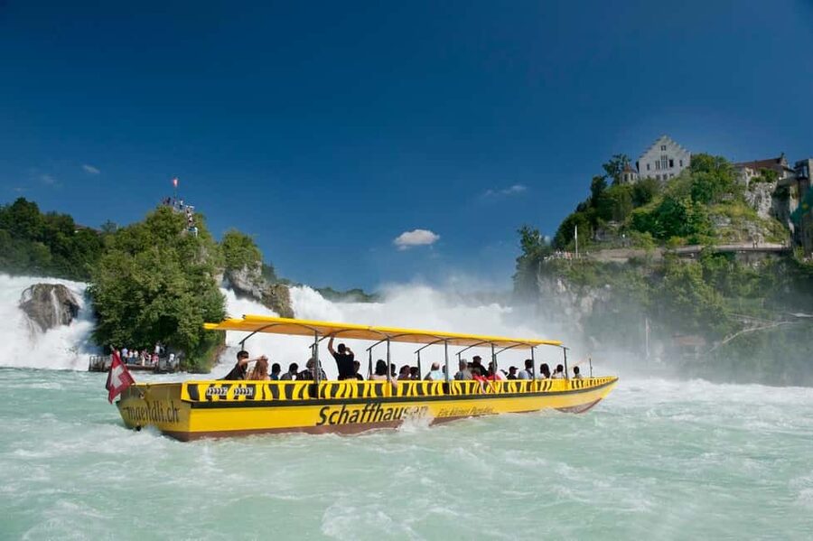 From Zurich: Rhine Falls Coach Tour with Entry Tickets - The optional boat ride toward the spray