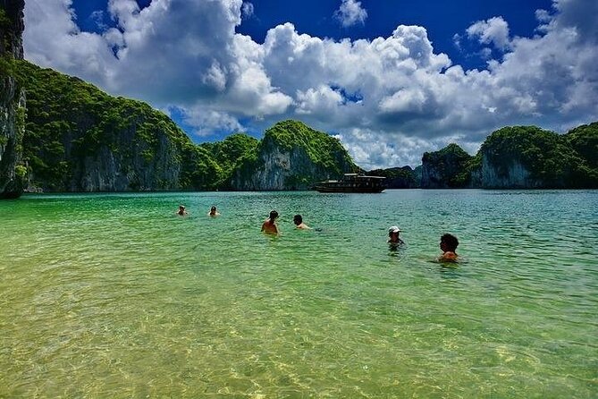 Ha Long Bay Day Cruise, Cave, Kayaking, Swimming, Bus & Lunch - Titov Island, beach time, and the hilltop