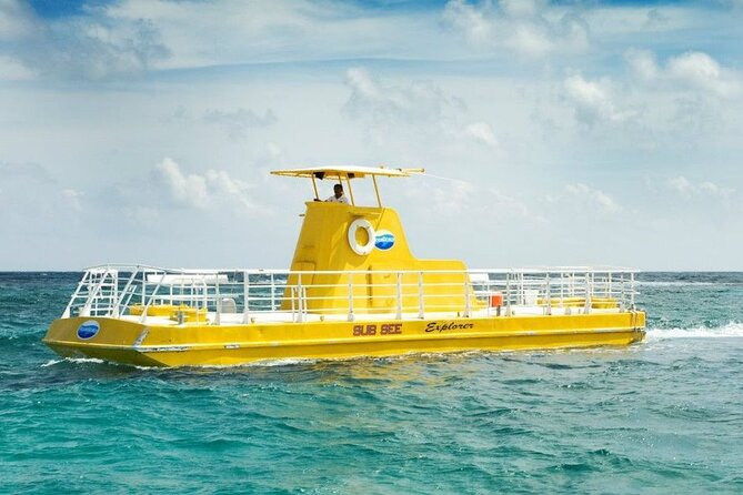 Hop-on Hop-off City Tour Cancun plus Submarine or Bodyboard Experience - Playa Delfines and the Cancun sign