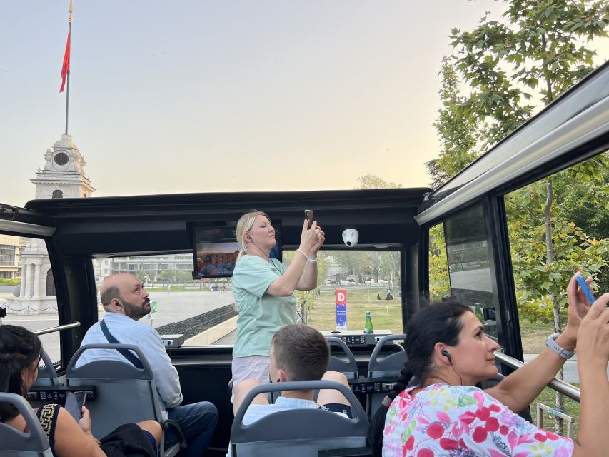 Istanbul: Two Continents Evening Bus Tour with Commentary - Besiktas and Taksim Square show the city after dark
