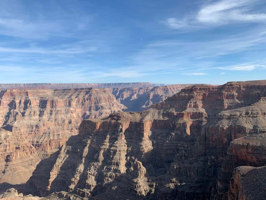 Las Vegas: Grand Canyon West Bus Tour with Guided Walk - What the guide and driver add