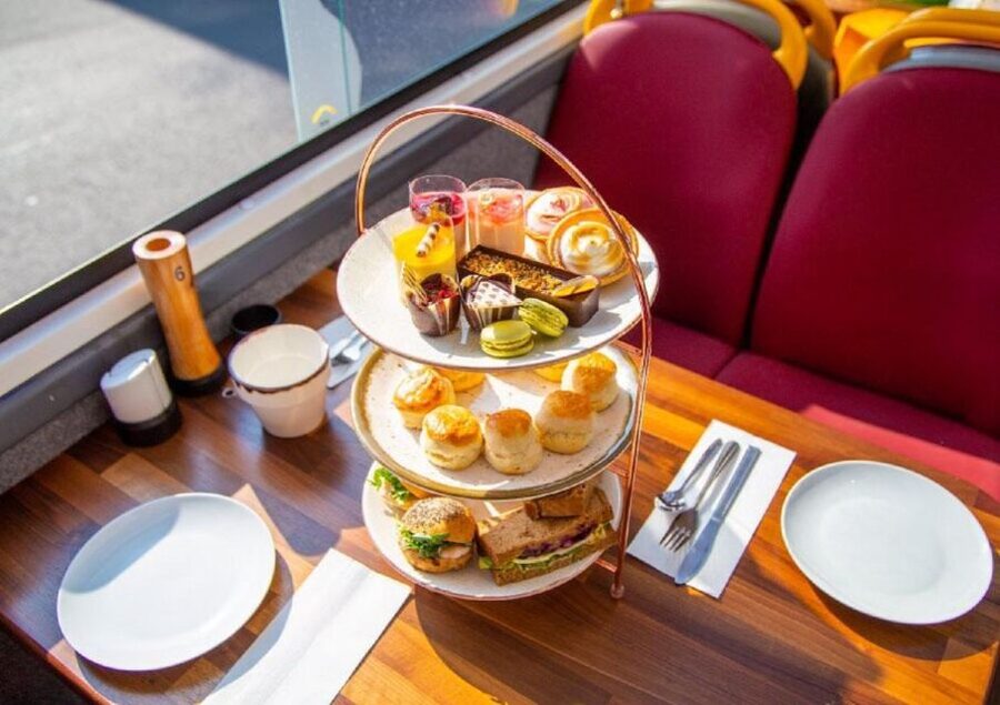 London: Afternoon Tea Bus with a Glass of Prosecco - Afternoon tea with London moving past the glass