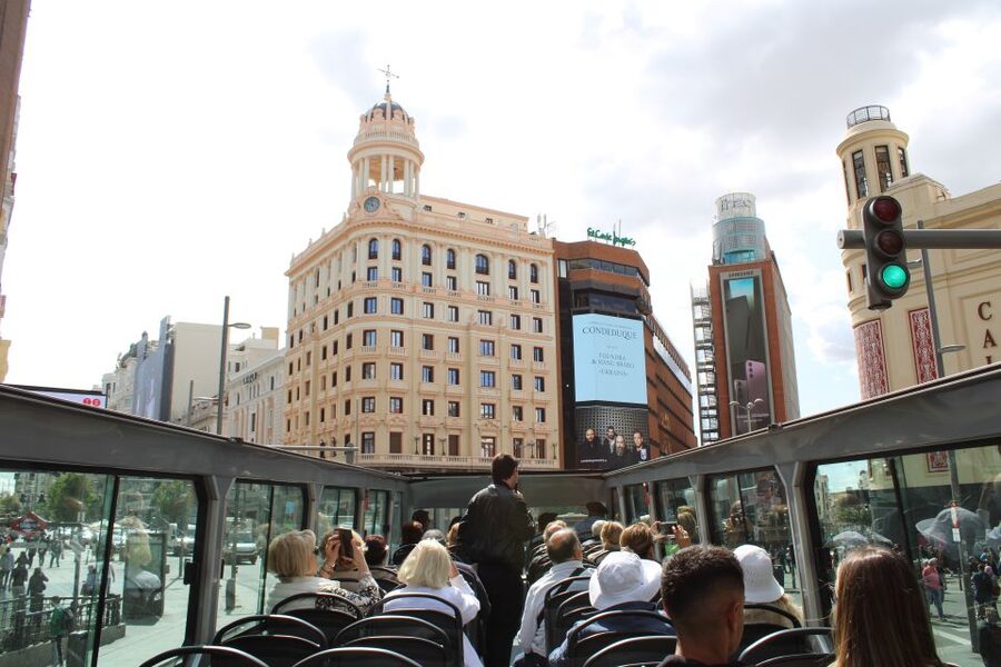 Madrid: Panoramic Open-Top Bus Day or Night Tour with Guide - Metropolis Building and Gran Vía lights