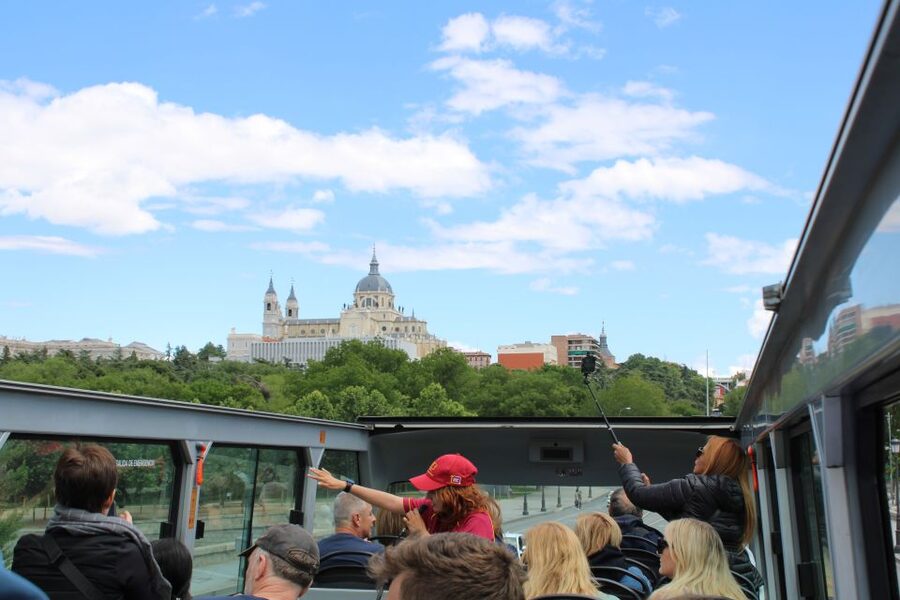 Madrid: Panoramic Open-Top Bus Day or Night Tour with Guide - Reina Sofía, Atocha, and the return to Goya