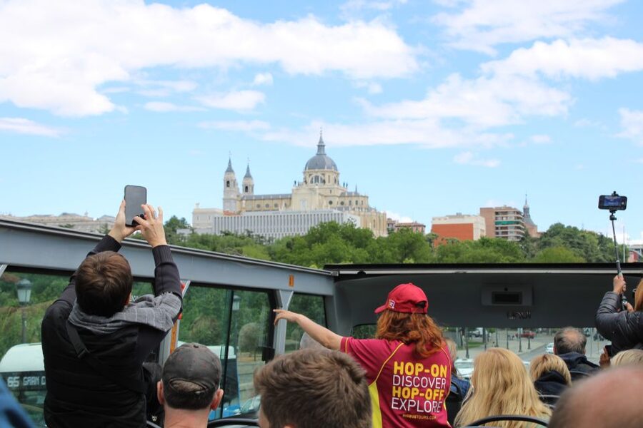 Madrid: Panoramic Open-Top Bus Day or Night Tour with Guide - What the bilingual guide adds