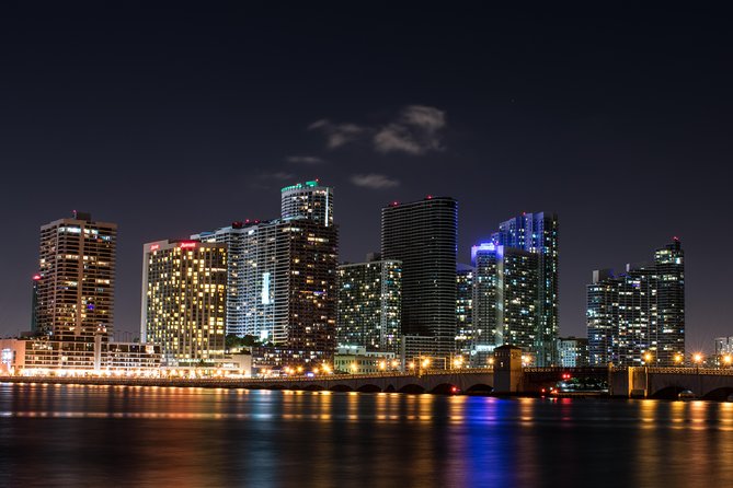Miami: Open-top Bus Sightseeing Night Tour with Live Guide - Star Island and the road back toward Downtown