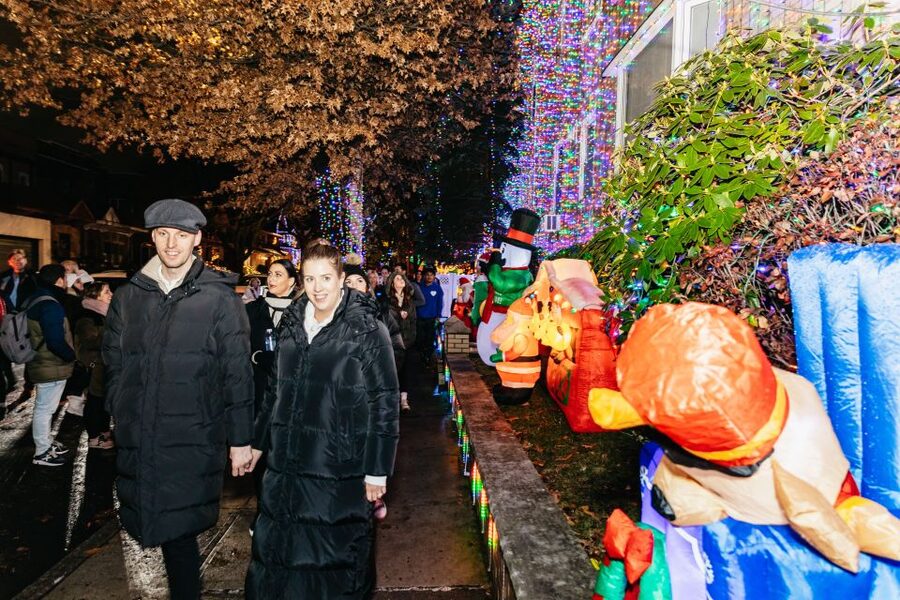 NYC: Dyker Heights Christmas Lights & Skyline View Bus Tour - Walking through Dyker Heights after dark