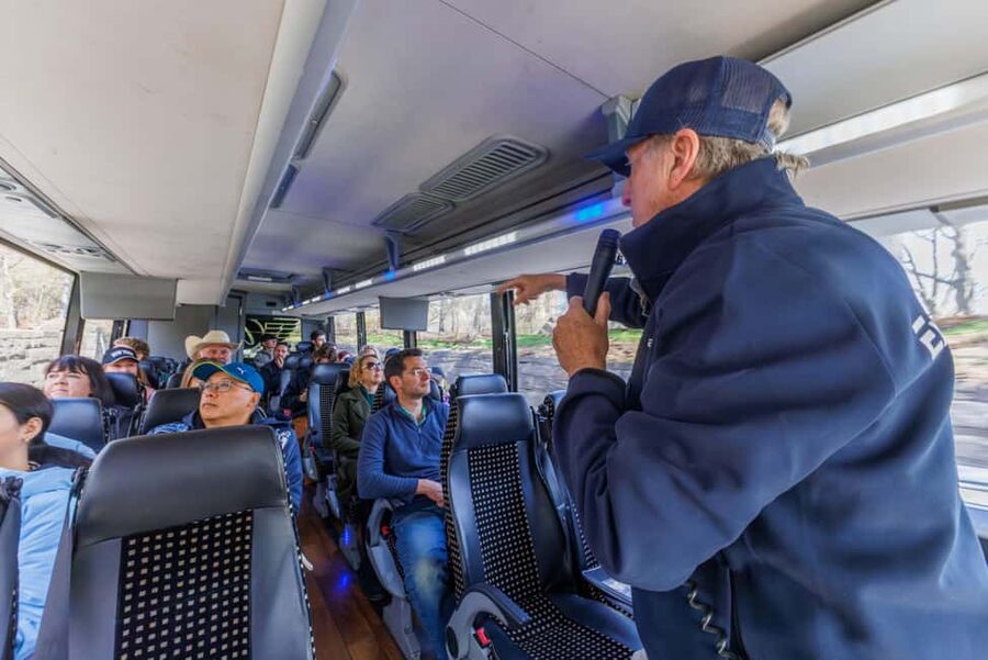NYC: Half-Day Luxury Bus Tour with Empire State Access - Radio City, Central Park, and the Dakota Building