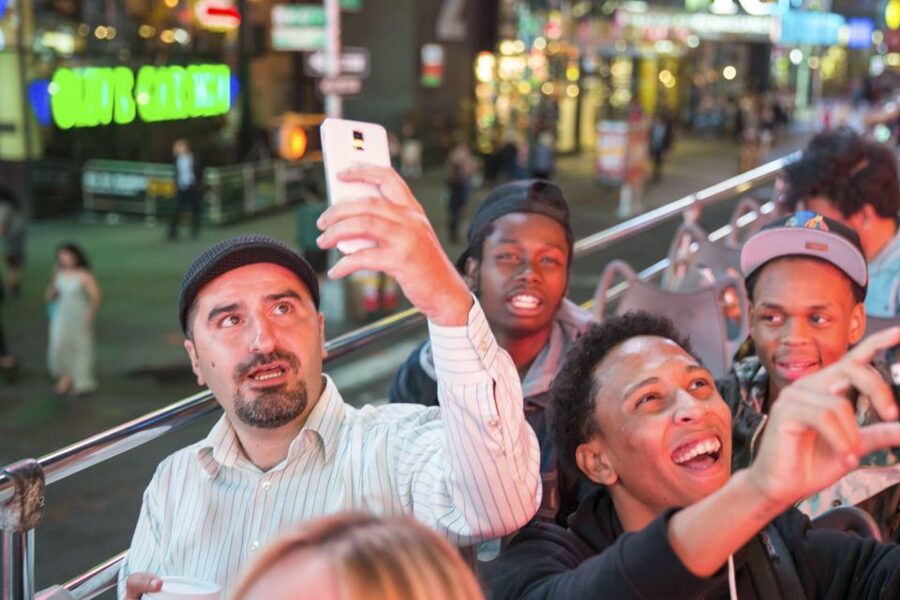 NYC: Sightseeing Night Tour by Open-Top Bus with Live Guide - Seeing New York switch on after sunset