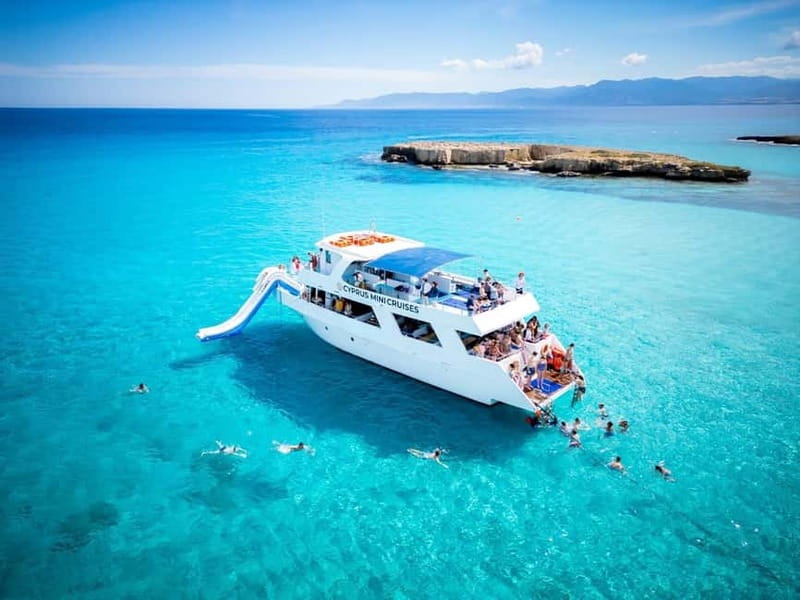 Paphos/Akamas: Blue Lagoon Bus & Boat Tour with Water Slide - Passing the Peyia sea caves and banana plantations