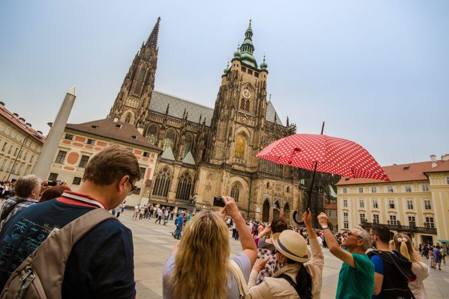 Prague: Guided Bus & Walking Tour with River Cruise & Lunch - Pickup, languages, and the trip back