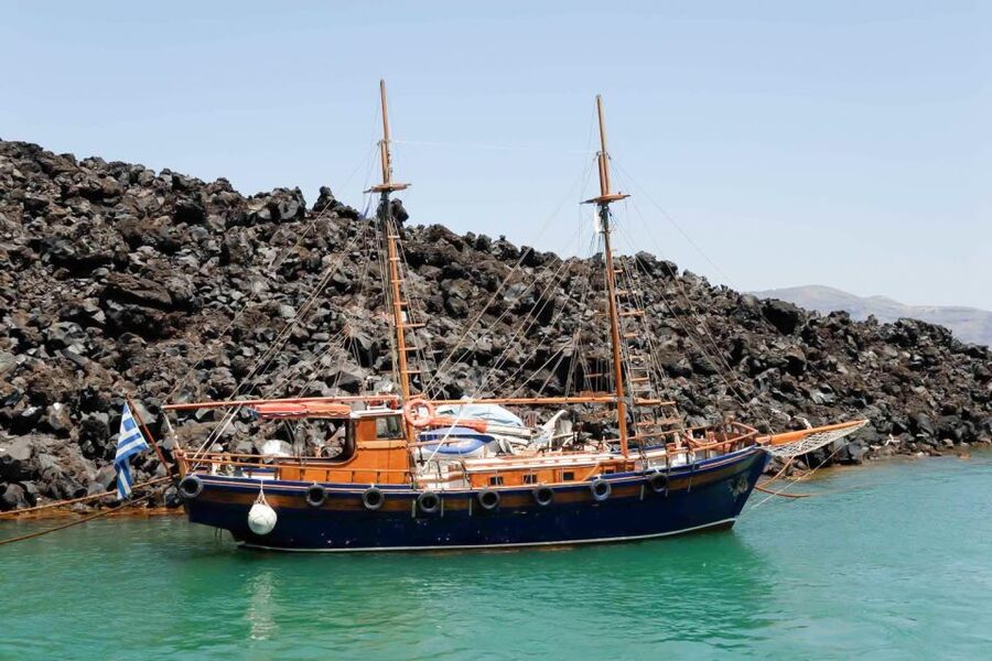 Santorini Island Bus Tour and Caldera Sunset Cruise - Nea Kameni means rough ground and volcanic history