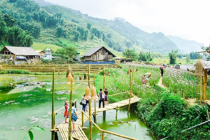 Sapa 2 Days 1 night By Bus/Train - Overnight in Hotel 3</em> With Mountain View – What this Sapa trip is really like’ /></p>
<p><p>This is a compact introduction to Sapa, not a slow village stay. You leave Hanoi early, reach Sapa around lunchtime, visit Cat Cat Village in the afternoon, sleep in town, then spend the next morning on the main valley trek before returning to Hanoi that evening.</p>
</p>
<p><p>That structure works well if you have only two days. You get two different walks, a hotel bed instead of a homestay, and a guide who handles the route and transport. You also get a look at rice cultivation, from the terraces and streams to the villages where the rice-growing tradition remains part of daily life.</p>
</p>
<p><p>The trip is less suitable if you want long stops for photography, a quiet rural night, or a demanding multi-day trek. The schedule leaves little spare time. Sapa is far from Hanoi, and much of the first and last day is spent on the road.</p>
</p>
<p><p>The advertised price is $84.27 per person. For that amount, the value is strongest if you want a ready-made package. Transport, hotel accommodation, four meals, entrance fees, guide service, and local transfers are included. You still pay for drinks, personal purchases, tips, and any single-room supplement.</p>
</p>
<div class="twil" style="margin: 20px 0; padding: 15px 0;"><p>More trips by rail around Hanoi:</p><ul style="margin: 10px 0; padding-left: 0; list-style: none;"><li style="margin: 0 0 12px 0; padding: 0 0 12px 0; border-bottom: 1px solid #FFE8E9; line-height: 1.4;"><a href="https://bustourer.com/hanoi-city-tour-bat-trang-train-street-lunch-luxury-bus/">Hanoi City Tour: Bat Trang, Train Street, Lunch & Luxury Bus</a><br><span style="font-size: 0.82em; color: #555;"><span style="color: #FF5A5F;">★</span> 4.9 &nbsp;&middot;&nbsp; 15 reviews</span></li><li style="margin: 0 0 12px 0; padding: 0 0 12px 0; border-bottom: 1px solid #FFE8E9; line-height: 1.4;"><a href="https://bustourer.com/1-day-1-2-day-hanoi-city-luxury-bus-lunch-train-street/">1 Day – 1/2 Day Hanoi City – Luxury Bus, Lunch, Train Street</a><br><span style="font-size: 0.82em; color: #555;"><span style="color: #FF5A5F;">★</span> 4.9 &nbsp;&middot;&nbsp; 8 reviews</span></li><li style="margin: 0; padding: 0; border-bottom: none; line-height: 1.4;"><a href="https://bustourer.com/sapa-bac-ha-trek-tour-night-train-bus-homestay-overnight/">Sapa – Bac Ha Trek Tour – Night Train & Bus & Homestay overnight</a><br><span style="font-size: 0.82em; color: #555;"><span style="color: #FF5A5F;">★</span> 5.0 &nbsp;&middot;&nbsp; 6 reviews</span></li></ul></div><h2>Leaving Hanoi for Sapa by bus</h2>
<p> With Mountain View – Leaving Hanoi for Sapa by bus’ /></p>
<p><p>Pickup is scheduled between 6:30 and 7:00 in the morning from the Hanoi Opera House at 1 Trang Tien, in Hoan Kiem. The bus then follows the highway toward Lao Cai, with a comfort stop around 9:30 and another around 11:00 before the final climb toward Sapa.</p>
</p>
<p><p>The vehicle is air-conditioned and may hold between 16 and 45 people. The overall group can reach 100 people, so you should not expect a tiny private outing. The bus includes cold water, wet tissues, and free Wi-Fi, though the useful quality of Wi-Fi can vary by location and vehicle.</p>
</p>
<p><p>The journey is a serious part of the trip. You arrive in Sapa at about 1:00 p.m., which means the morning is mostly transportation. I would avoid planning another activity in Hanoi before pickup, and I would keep your first-day clothing and walking shoes easy to reach.</p>
</p>
<p><p>Train travel is not included in the standard program. You can request train tickets for an extra $15 each way, using a soft sleeping cabin shared by four people. If you choose that option, confirm how it fits with the scheduled program before booking. The published itinerary itself is built around bus travel.</p>
</p>
<h2>First taste of Sapa town at lunchtime</h2>
<p><img width="669" height="446" decoding="async" src=