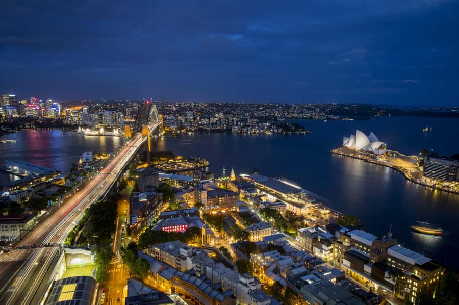 Sydney: Big Bus Panoramic Night Tour by Open-Top Bus - Crossing Harbour Bridge toward Milsons Point