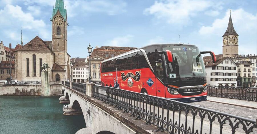 Zurich: City Bus Tour with Audio Guide and Lake Cruise - Bahnhofstrasse, banks, and the first look toward the lake